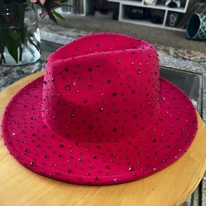 Pink rhinestoned wide brim fedora hat.